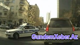 Bakıda yol polisi bədəniylə maşını saxlamağa çalışır - VIDEO